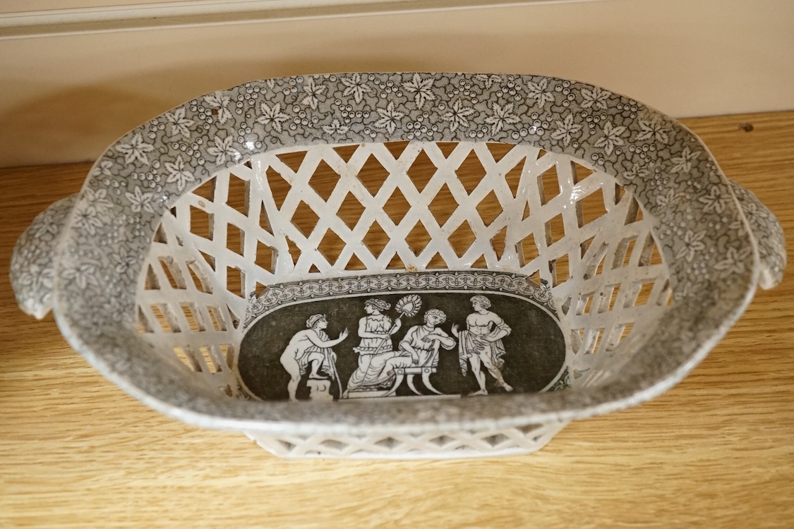 A pair of early 19th century pearlware transfer decorated figural two handled chestnut baskets and stands, attributed to Herculanuem, baskets 27cm wide including handles.